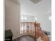 Upstairs hallway with wooden railing and a view to the first floor at 3788 E Sexton St, Gilbert, AZ 85295