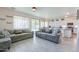 Bright living area with wood-look flooring open to the dining area and kitchen at 3788 E Sexton St, Gilbert, AZ 85295
