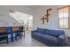 Comfortable living area with light wood floors and blue sofa at 3788 E Sexton St, Gilbert, AZ 85295
