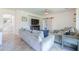 Open-concept living room with tile floors and a decorative sliding barn door at 3788 E Sexton St, Gilbert, AZ 85295