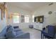 Inviting living room features light wood floors, natural light, and a cozy blue sofa at 3788 E Sexton St, Gilbert, AZ 85295
