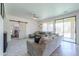 Comfortable living room featuring a sliding barn door and access to the backyard at 3788 E Sexton St, Gilbert, AZ 85295