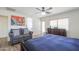 Main bedroom with an accent chair, a bed, and a dresser near the windows at 3788 E Sexton St, Gilbert, AZ 85295