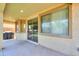 Covered patio with sliding glass door entrance to the home, view of artificial turf backyard at 3788 E Sexton St, Gilbert, AZ 85295