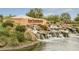 Scenic entrance to San Tan Heights features a rock waterfall and lush landscaping at 4034 W Nora Dr, San Tan Valley, AZ 85144