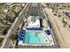 Aerial view of the community pool featuring sunshades and ample room for swimming at 4034 W Nora Dr, San Tan Valley, AZ 85144