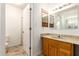 Bathroom view with a marbled countertop vanity and wooden framed mirrors at 4107 W Campo Bello Dr, Glendale, AZ 85308