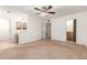 Spacious bedroom with a ceiling fan and multiple entrances to bathrooms at 4107 W Campo Bello Dr, Glendale, AZ 85308