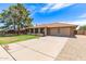 Well-maintained home featuring a spacious driveway and manicured front yard at 4107 W Campo Bello Dr, Glendale, AZ 85308