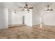 Spacious living room featuring tile flooring, high ceilings, ceiling fans, and neutral paint at 4107 W Campo Bello Dr, Glendale, AZ 85308
