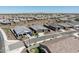 An aerial view of a suburban neighborhood with desert landscaping, mountain views, and well-maintained streets at 41800 W Sonoran Trl, Maricopa, AZ 85138