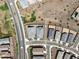 Aerial view of homes in a well-planned community with desert landscaping, sidewalks, and nearby green spaces at 41800 W Sonoran Trl, Maricopa, AZ 85138