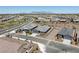 An aerial view of a suburban neighborhood with desert landscaping, mountain views, and well-maintained streets at 41800 W Sonoran Trl, Maricopa, AZ 85138
