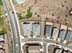 Aerial view of homes in a well-planned community with desert landscaping, sidewalks, and nearby green spaces at 41800 W Sonoran Trl, Maricopa, AZ 85138