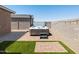 Outdoor spa area with a covered hot tub and landscaped patio at 41800 W Sonoran Trl, Maricopa, AZ 85138