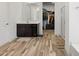 Bathroom with wood-look flooring, spacious vanity and sink, and walk-in closet at 41800 W Sonoran Trl, Maricopa, AZ 85138