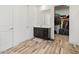 Bathroom with wood-look flooring, spacious vanity and sink, and walk-in closet at 41800 W Sonoran Trl, Maricopa, AZ 85138