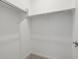 Spacious walk-in closet with shelving and rods, offering organized storage solutions at 41800 W Sonoran Trl, Maricopa, AZ 85138