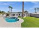 Spacious backyard with pool, grass, tall trees, and basketball court at 4216 N 20Th St, Phoenix, AZ 85016