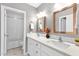 Neutral bathroom offers double sinks, framed mirrors, and tiled shower/bath combo, providing a serene atmosphere at 4216 N 20Th St, Phoenix, AZ 85016