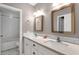 Bathroom features double sinks, framed mirrors, and tiled shower/tub combo at 4216 N 20Th St, Phoenix, AZ 85016