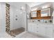 Renovated bathroom showcases a glass-enclosed shower, modern fixtures, and sleek tile, providing a spa-like experience at 4216 N 20Th St, Phoenix, AZ 85016