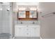 Bright bathroom with double vanity and tiled shower at 4216 N 20Th St, Phoenix, AZ 85016
