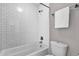 Cozy bathroom with combined shower and bath, tiled white, complemented by chrome fixtures and a neutral wall color at 4216 N 20Th St, Phoenix, AZ 85016