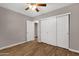 Bright bedroom featuring wood floors and large closet with sliding doors at 4216 N 20Th St, Phoenix, AZ 85016