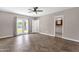 Bedroom featuring wood floors, ceiling fan, backyard access, and bathroom access at 4216 N 20Th St, Phoenix, AZ 85016