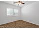 Bedroom with new window and white walls, enhanced by wood-look flooring at 4216 N 20Th St, Phoenix, AZ 85016