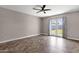 Bright bedroom featuring unique wood floors, ceiling fan, and backyard access at 4216 N 20Th St, Phoenix, AZ 85016
