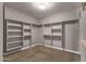 Walk-in closet featuring ample shelving, rods, and lighting at 4216 N 20Th St, Phoenix, AZ 85016