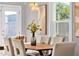 Elegant dining room with modern chandelier, decorative art, and lots of natural light at 4216 N 20Th St, Phoenix, AZ 85016