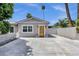Charming single-story home with an inviting yellow front door, complemented by mature landscaping at 4216 N 20Th St, Phoenix, AZ 85016