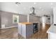 Spacious kitchen island with stainless steel appliances and view into the living room at 4216 N 20Th St, Phoenix, AZ 85016