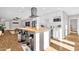 Open concept kitchen boasts an island with seating, stainless steel appliances and plenty of counter space at 4216 N 20Th St, Phoenix, AZ 85016