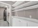 Convenient laundry room with ample storage and shelving at 4216 N 20Th St, Phoenix, AZ 85016