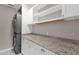 Functional laundry room with granite countertops and storage at 4216 N 20Th St, Phoenix, AZ 85016