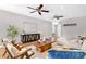 Cozy living room features wood floors, ceiling fans, modern decor and an entertainment center at 4216 N 20Th St, Phoenix, AZ 85016