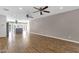 Open-concept living area with hardwood floors, a kitchen island, and plenty of space for entertaining at 4216 N 20Th St, Phoenix, AZ 85016