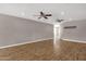 Spacious living room featuring hardwood floors and dual ceiling fans at 4216 N 20Th St, Phoenix, AZ 85016