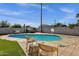 A serene pool area is featured, complete with inviting lounge seating and a hot tub for relaxation and backyard fun at 4216 N 20Th St, Phoenix, AZ 85016