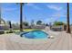 Backyard features refreshing pool, turf, and tall palm trees at 4216 N 20Th St, Phoenix, AZ 85016