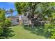 A large treehouse in a shady backyard, built around the trunk of a mature tree at 4216 N 20Th St, Phoenix, AZ 85016