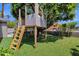 Backyard treehouse with a ladder and artificial lawn at 4216 N 20Th St, Phoenix, AZ 85016