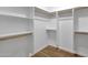 Walk-in closet offers plenty of storage space with shelving and hanging rods at 4216 N 20Th St, Phoenix, AZ 85016