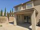 Backyard featuring a covered patio with large support beams and block wall fence at 42435 W Desert Fairways Dr, Maricopa, AZ 85138