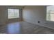Spacious bedroom featuring vaulted ceiling, light floors, and bright windows at 42435 W Desert Fairways Dr, Maricopa, AZ 85138