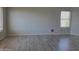 Bedroom featuring light wood flooring and natural light at 42435 W Desert Fairways Dr, Maricopa, AZ 85138